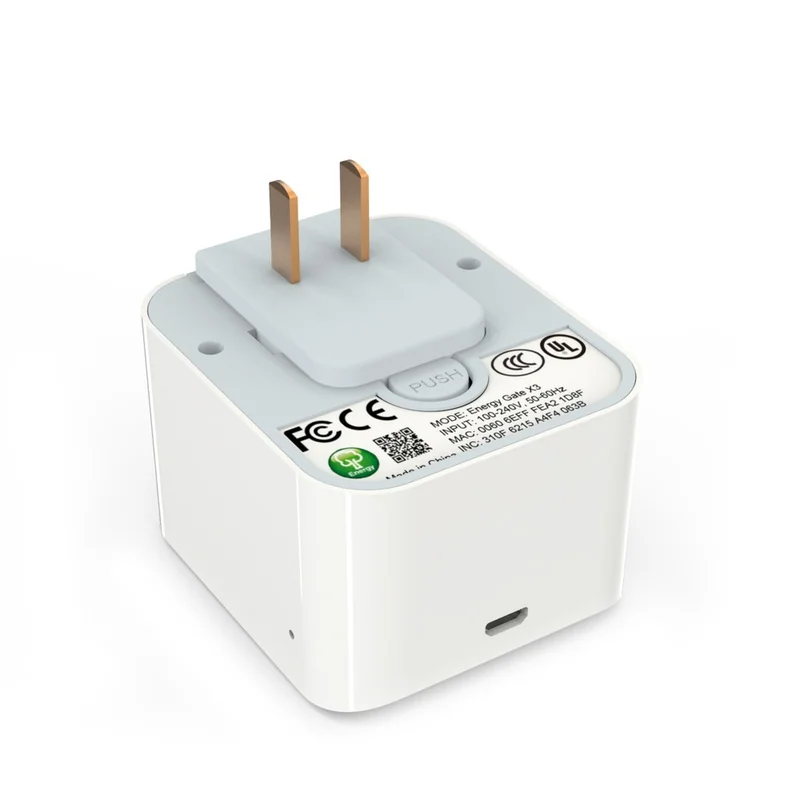 SEG-X3-N gateway photographed from below with the two plug pins up beside the QR-coded certification label